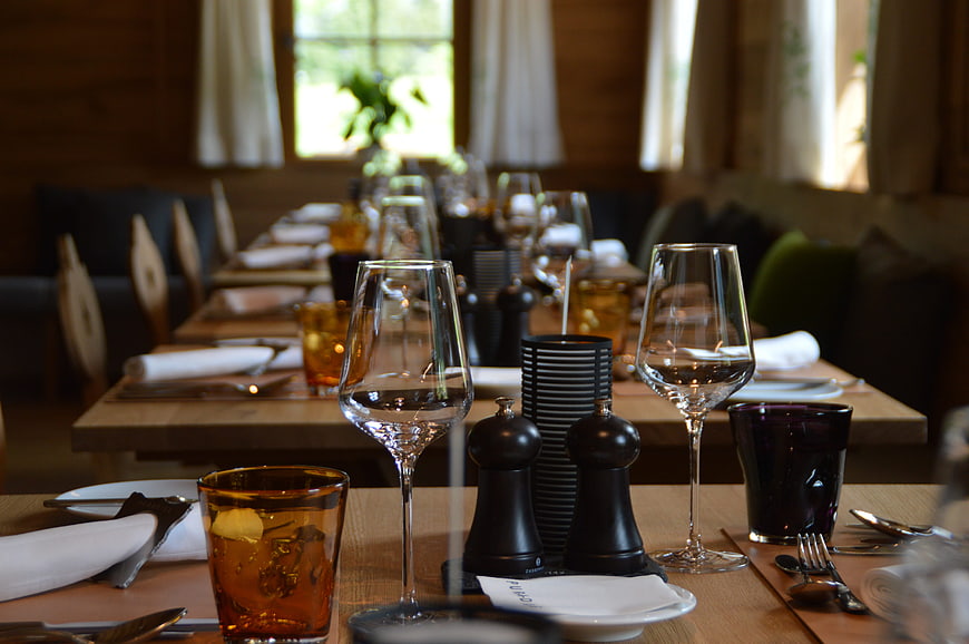 Elegant Restaurant Table Setting With Wine Glasses And Cutlery