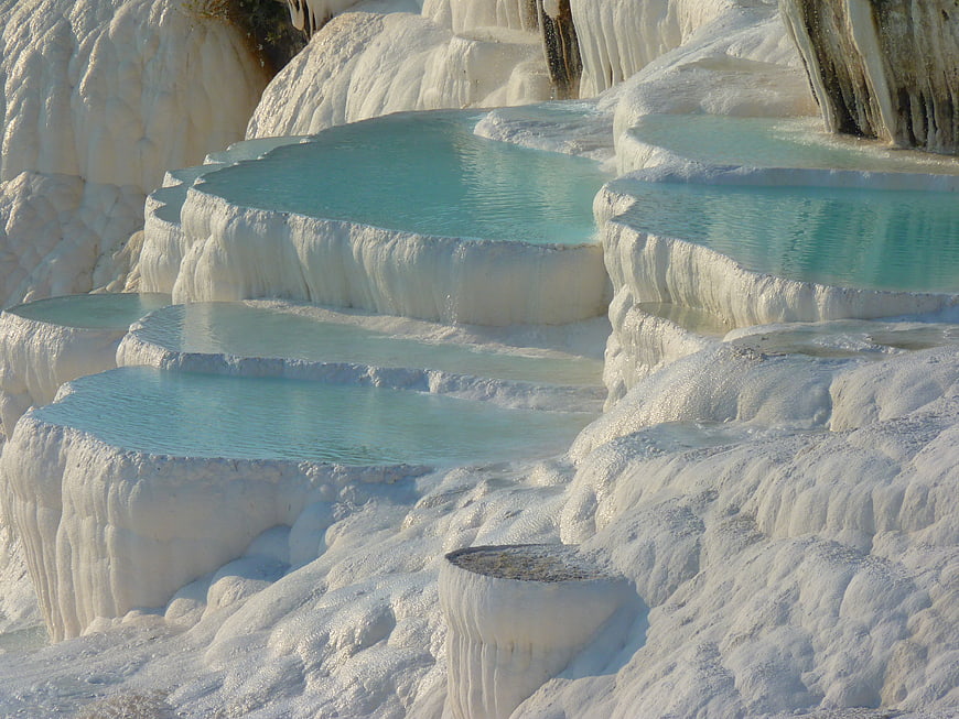 White travertine terraces with turquoise thermal pools at Pamukkale