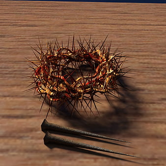 Crown of Thorns and Nails on Wooden Surface