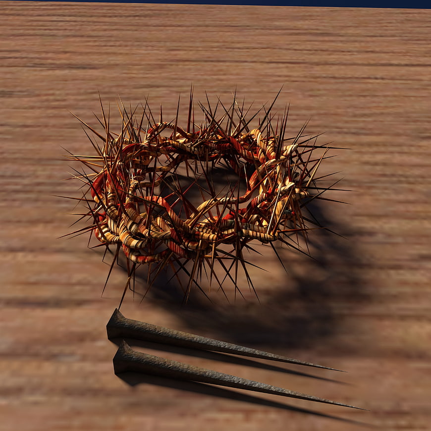 Crown of Thorns and Nails on Wooden Surface