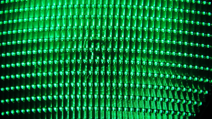Close-up of green LED traffic light matrix pattern