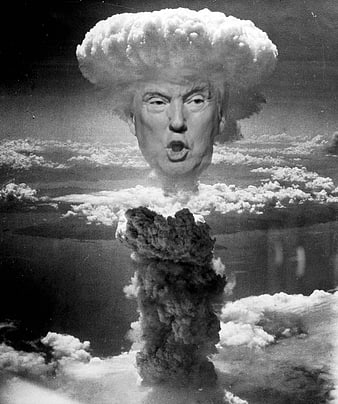 Black and white photo of mushroom cloud with face