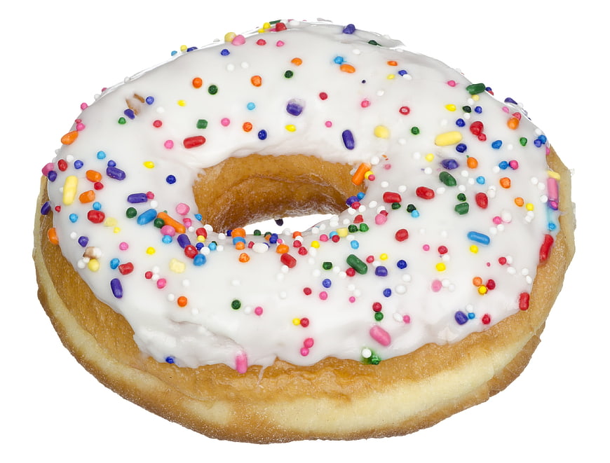 White Frosted Donut With Colorful Sprinkles On White Background