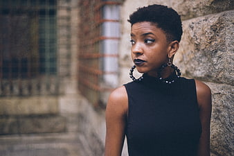 Stylish Black Woman with Short Hair and Bold Earrings