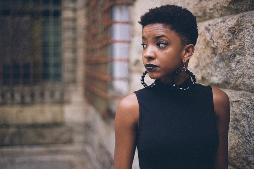 Stylish Black Woman with Short Hair and Bold Earrings