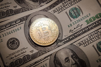 Bitcoin Coin On US Dollar Bills