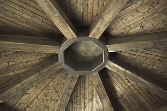 Octagonal wooden ceiling with radial beams and central vent