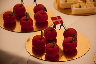 Red Apple Shaped Cakes On Gold Platters With Danish Flag
