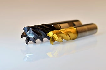 Professional Macro Shot of Black and Gold CNC Milling Cutters