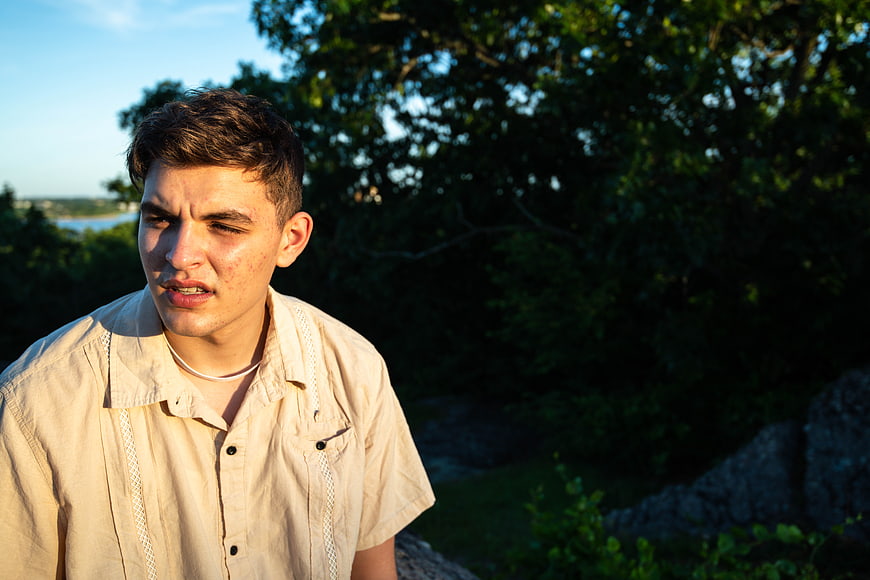 Young Man Portrait Outdoors in Golden Hour Sunlight