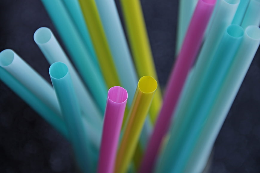 Colorful Plastic Drinking Straws Close Up On Dark Background