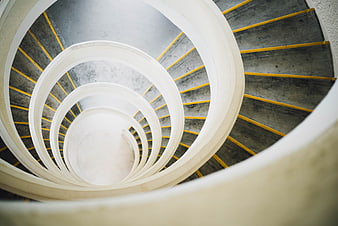 Abstract View of Concrete Spiral Staircase with Yellow Stripes