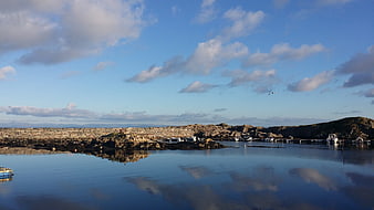 Serene Norwegian Lagoon with Seaweed Farms and Boats