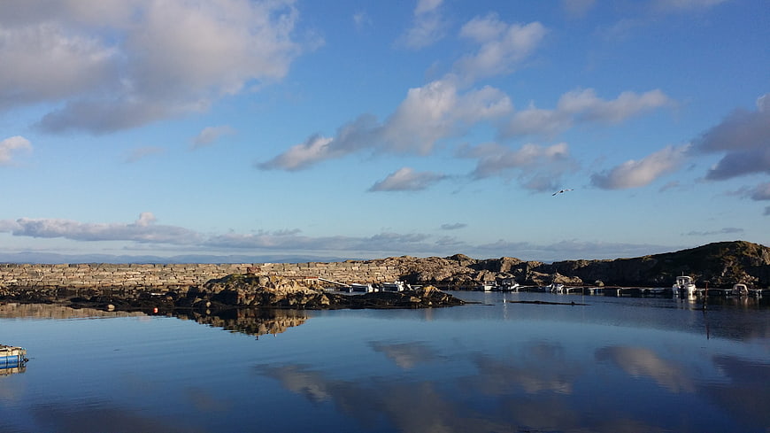 Serene Norwegian Lagoon with Seaweed Farms and Boats