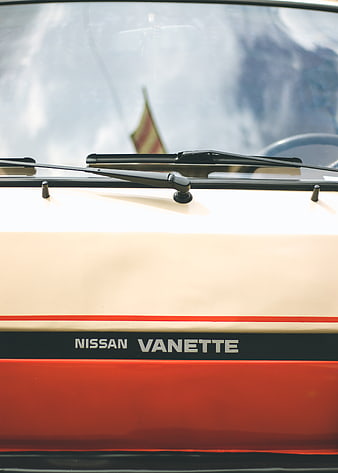 Close-up of vintage Nissan Vanette van with retro stripes