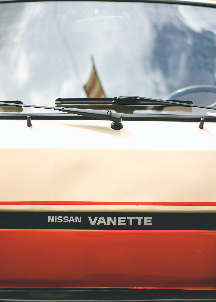 Close-up of vintage Nissan Vanette van with retro stripes