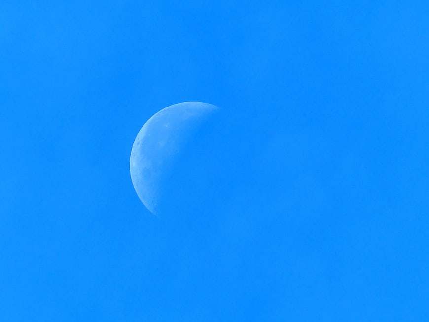 Crescent Moon in Bright Blue Sky