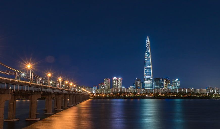 Seoul Cityscape at Night with Lotte World Tower and Han River Bridge