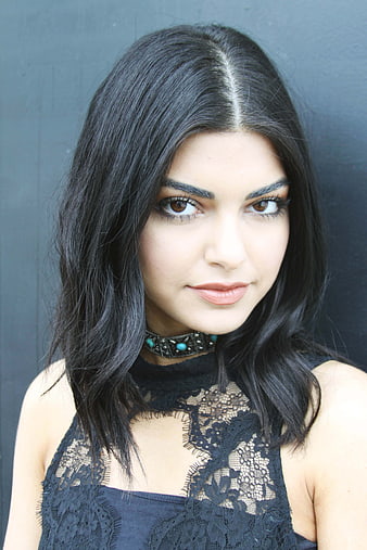 Portrait of a woman with dark hair and black lace top