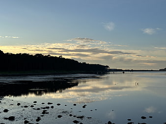 Serene River Landscape with Cloud Reflections at Dusk