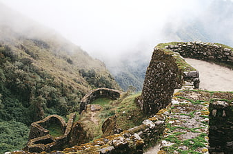 Misty stone ruins of Machu Picchu in the Peruvian mountains