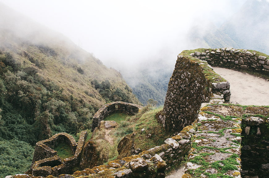 Misty stone ruins of Machu Picchu in the Peruvian mountains
