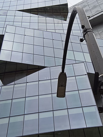 Modern Glass Building Facade with Street Lamp