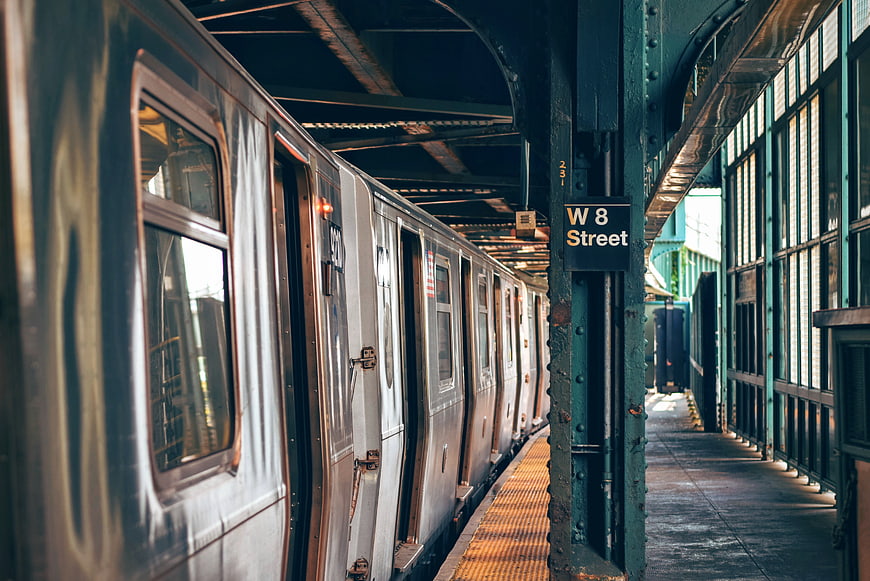 Subway train at W 8 Street station platform
