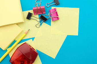 Colorful Office Supplies Flat Lay on Blue Background