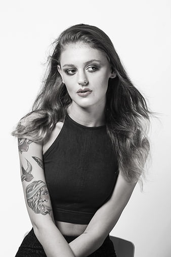 Black and white portrait of woman with tattoos