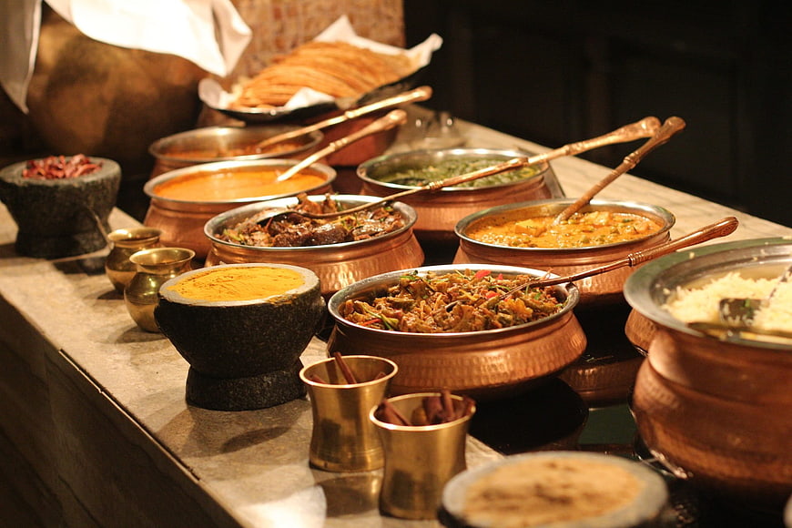 Traditional Indian buffet spread with copper serving dishes