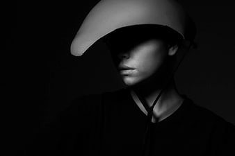 Dramatic Black and White Portrait of Woman in Helmet