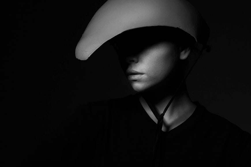 Dramatic Black and White Portrait of Woman in Helmet