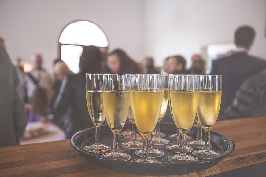 Tray of Champagne Flutes at a Social Event