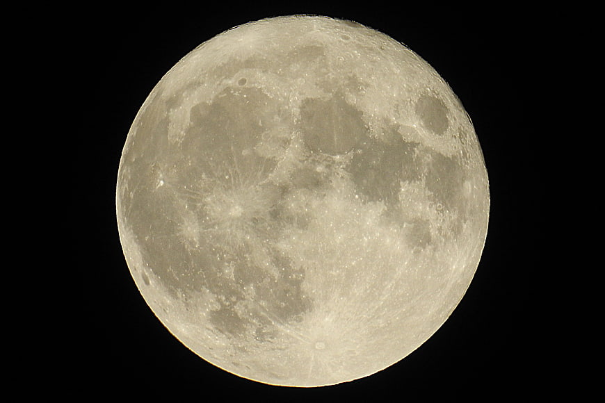 Full Moon Close-Up with Craters on Black Background