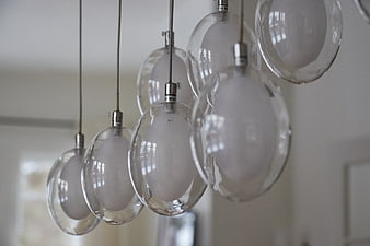 Modern hanging glass pendant lights in interior design