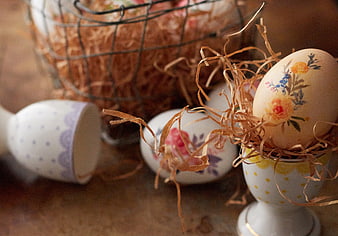 Decorative Easter Eggs in Ceramic Holders with Floral Patterns