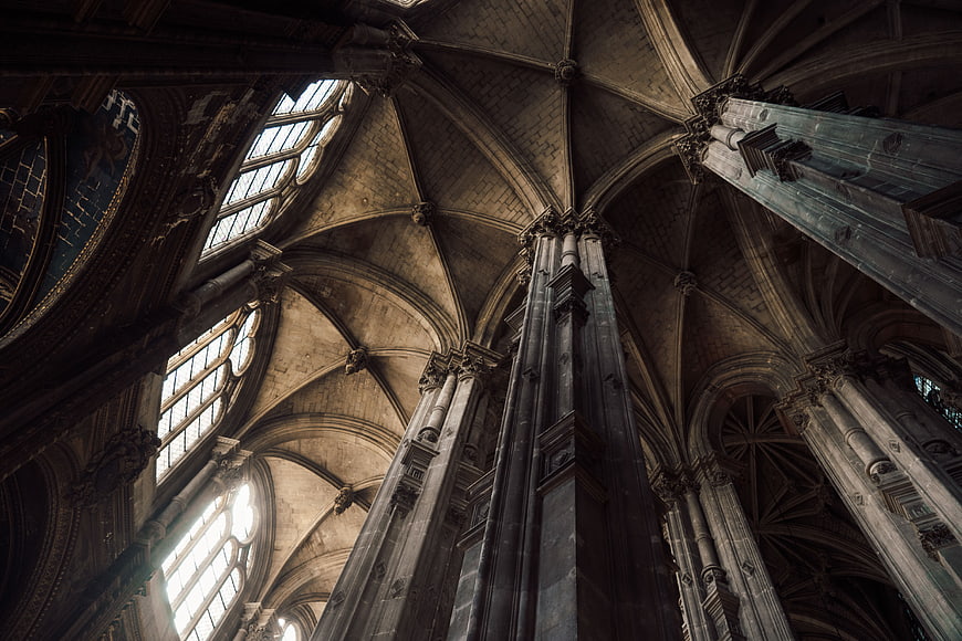 Gothic Cathedral Interior with Vaulted Ceilings and Stone Pillars