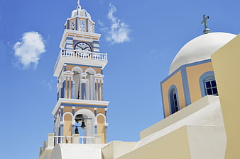 Greek Orthodox Church Bell Tower and Dome Against Blue Sky