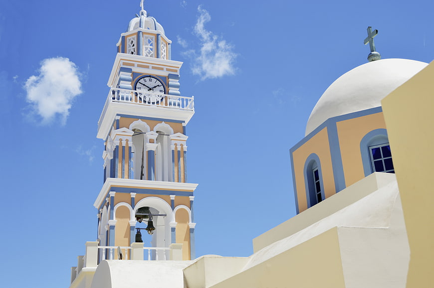 Greek Orthodox Church Bell Tower and Dome Against Blue Sky