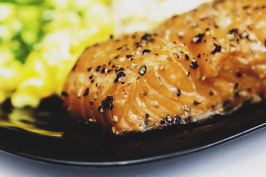 Close-up of Pan-Seared Salmon Fillet with Scrambled Eggs