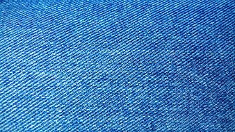 Close-up texture of blue denim fabric weave pattern