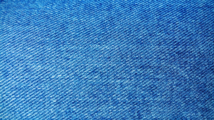 Close-up texture of blue denim fabric weave pattern
