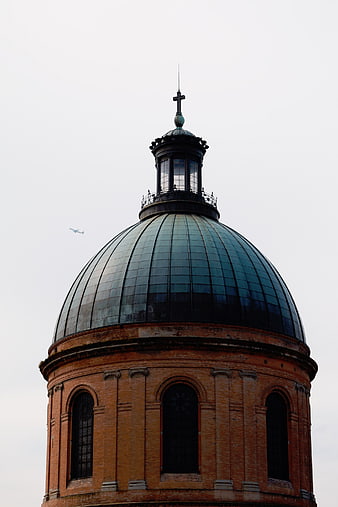 Green Copper Dome of Historic Brick Church Tower