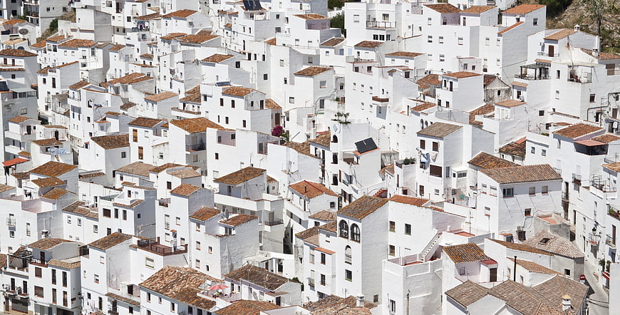 White houses with terracotta roofs in Spanish village