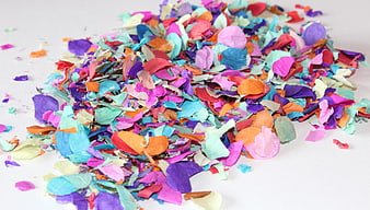 Colorful Paper Confetti Pile on White Background