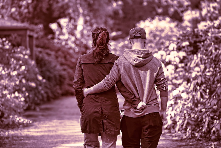 Couple Walking Away in Park with Purple Filter