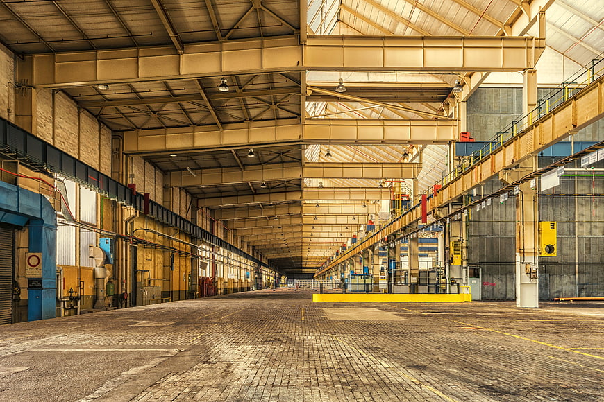 Empty Industrial Warehouse Interior with Steel Beams