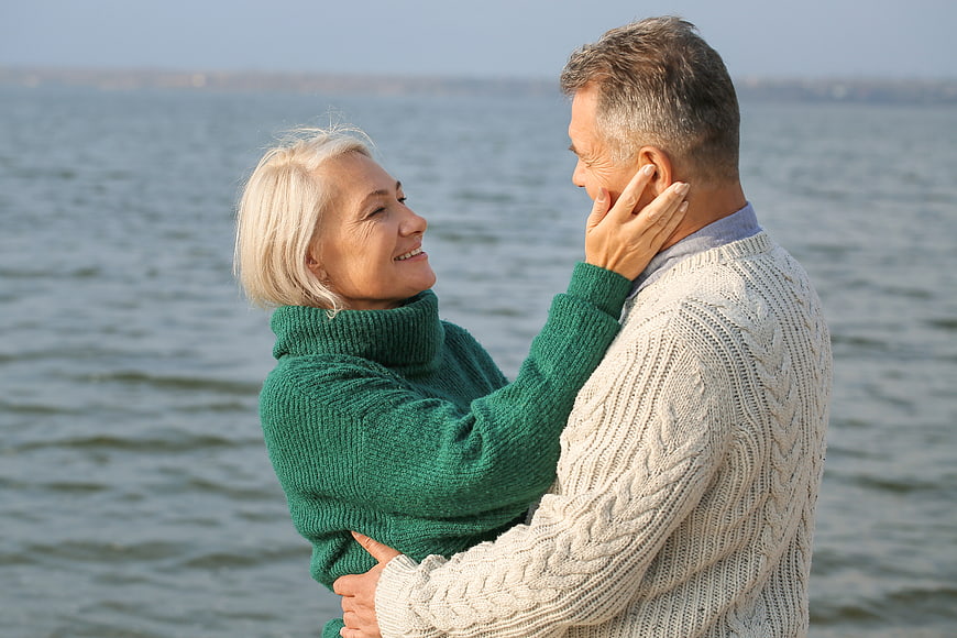 Happy Senior Couple Embracing by the Sea