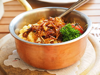 Swabian Kässpätzle with Fried Onions and Parsley in Copper Pot